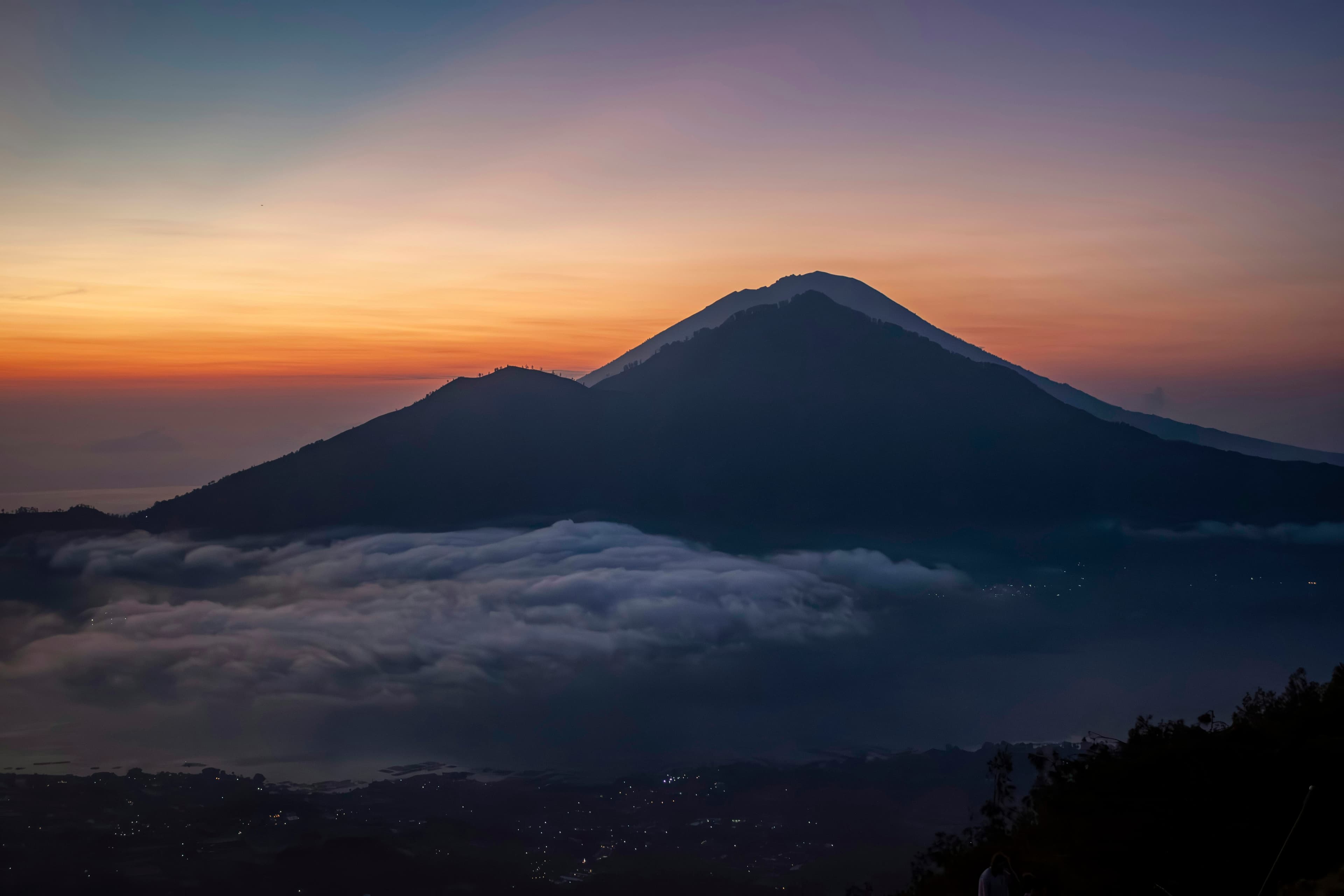Sunrise over a Himalayan summit, seen from above the clouds